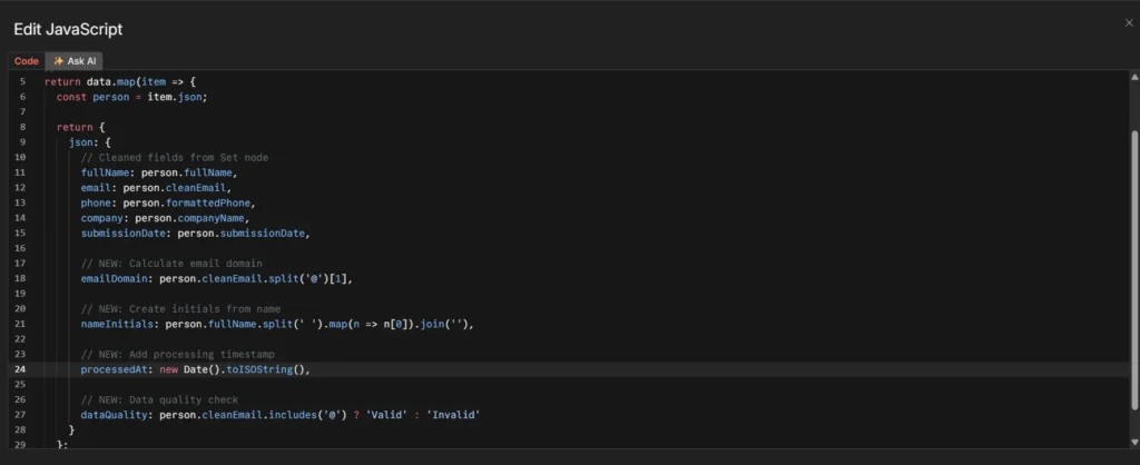 n8n Code node with JavaScript for calculating email domain, name initials, timestamp, and data quality validation